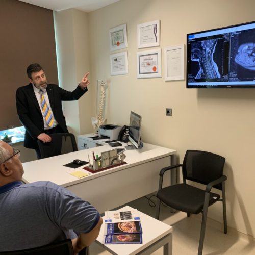 Doctor Salih Aydin is looking at x-ray images of a patient