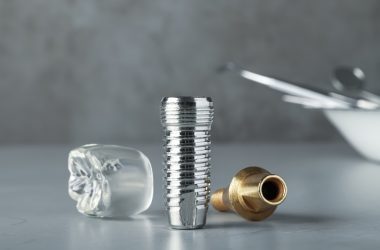 Parts,Of,Dental,Implant,On,Grey,Table,,Closeup