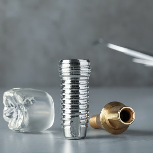 Parts,Of,Dental,Implant,On,Grey,Table,,Closeup