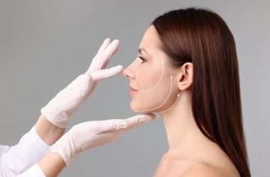 Woman,Preparing,For,Plastic,Surgery,,Grey,Background.,Doctor,Examining,Her