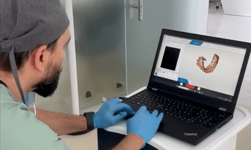 Dentist Bilal Turan is treating a patient at his private clinic Sindent Dental Clinic